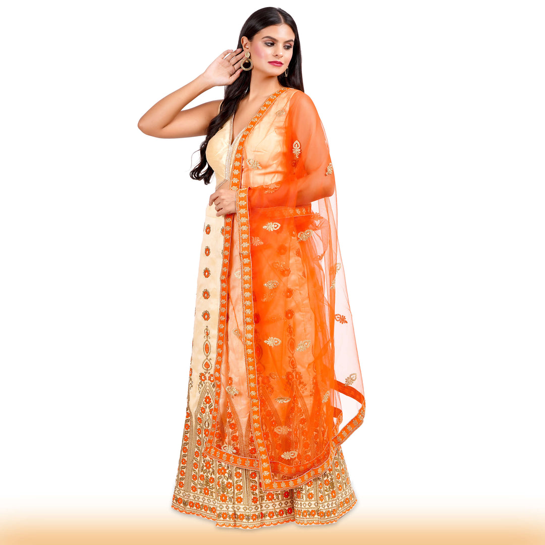 Beige Embroidered lehenga with orange embroidery and contrast duppatta